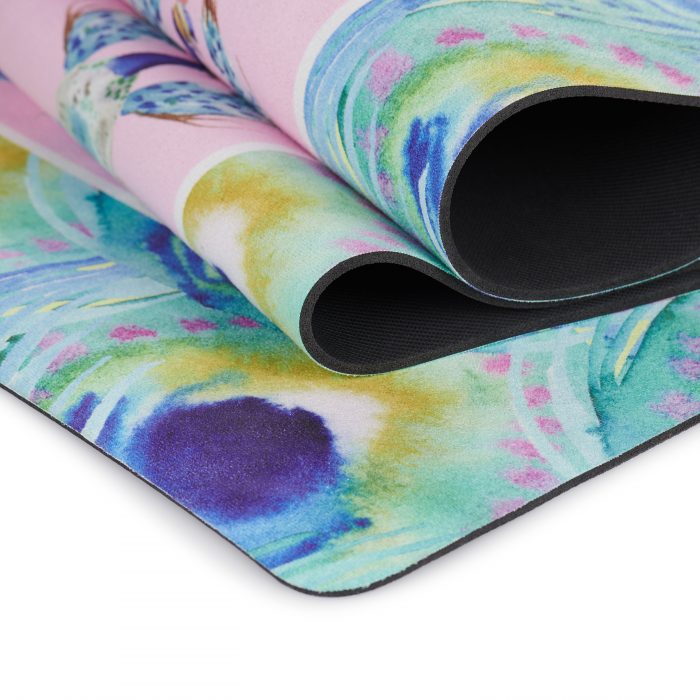 peacock design doing yoga on yoga mat with pink background folded over