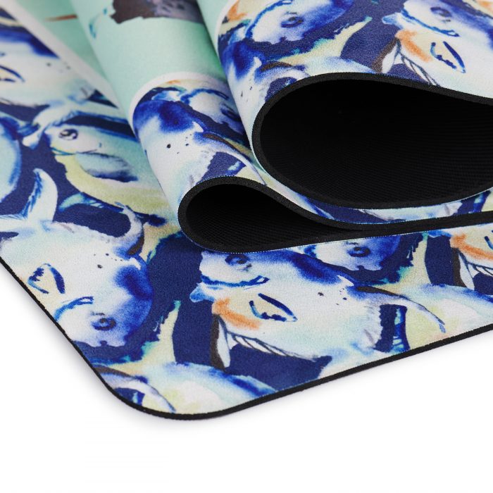 suede yoga mat with pelican doing yoga on navy green background folded