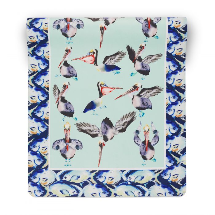suede yoga mat with pelican doing yoga on navy green background